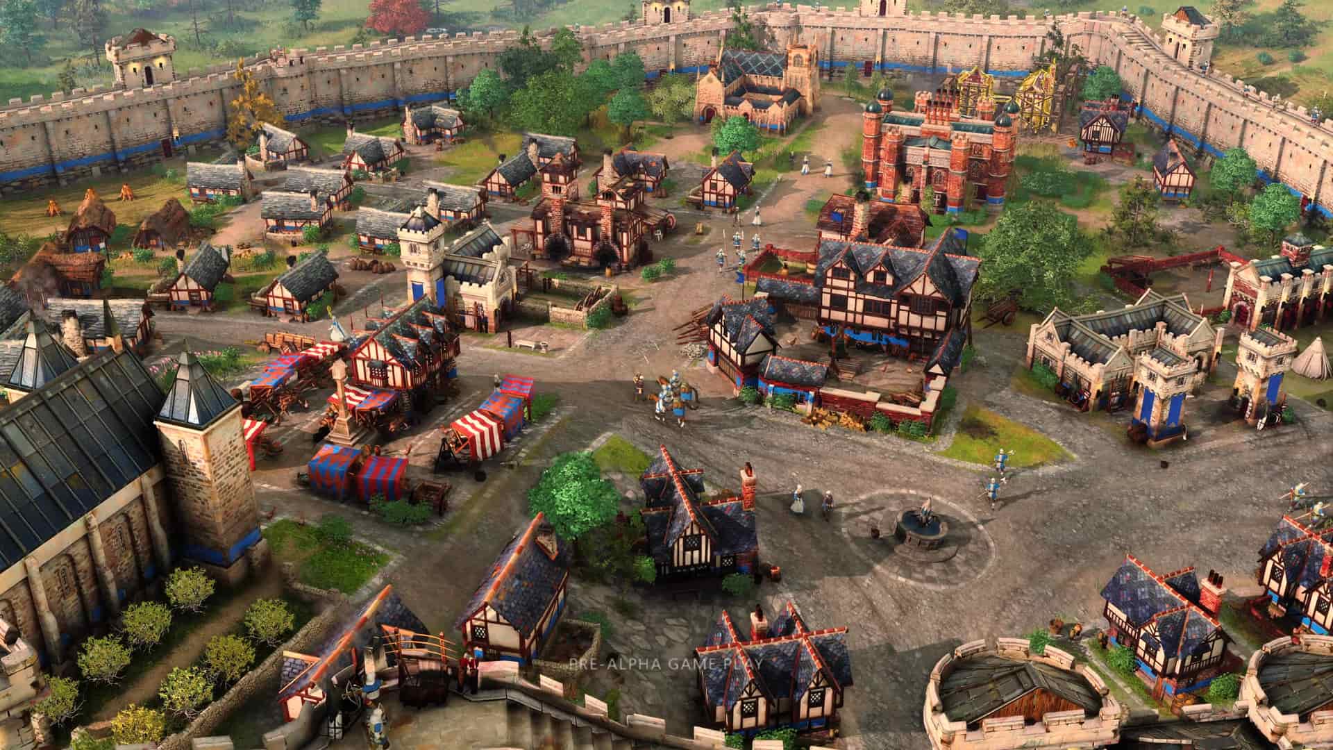 captura del juego age of empires 4 donde se ve una aldea desde arriba